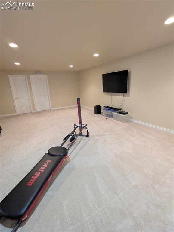 Image 23 of 33: Workout area with recessed lighting and carpet flooring