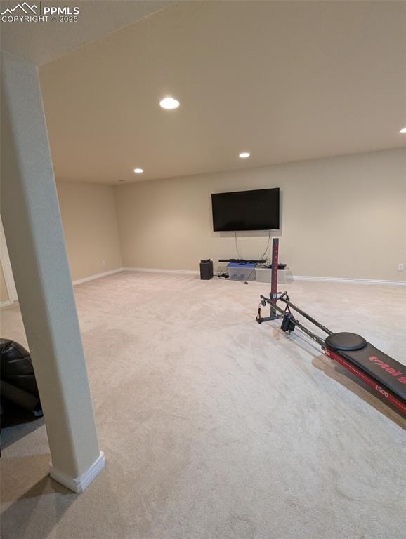Image 25 of 33: Workout room featuring light colored carpet and recessed lighting