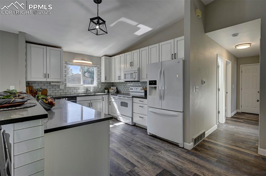 Image 4 of 49: Updated Quartz Counters, lighting & Newer appliances