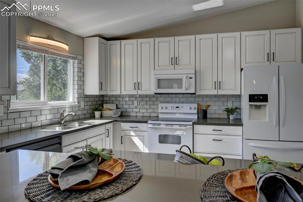 Image 5 of 49: Updated Cabinets and Backsplash