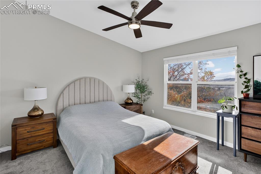 Image 6 of 14: Primary bedroom w/ vaulted ceiling