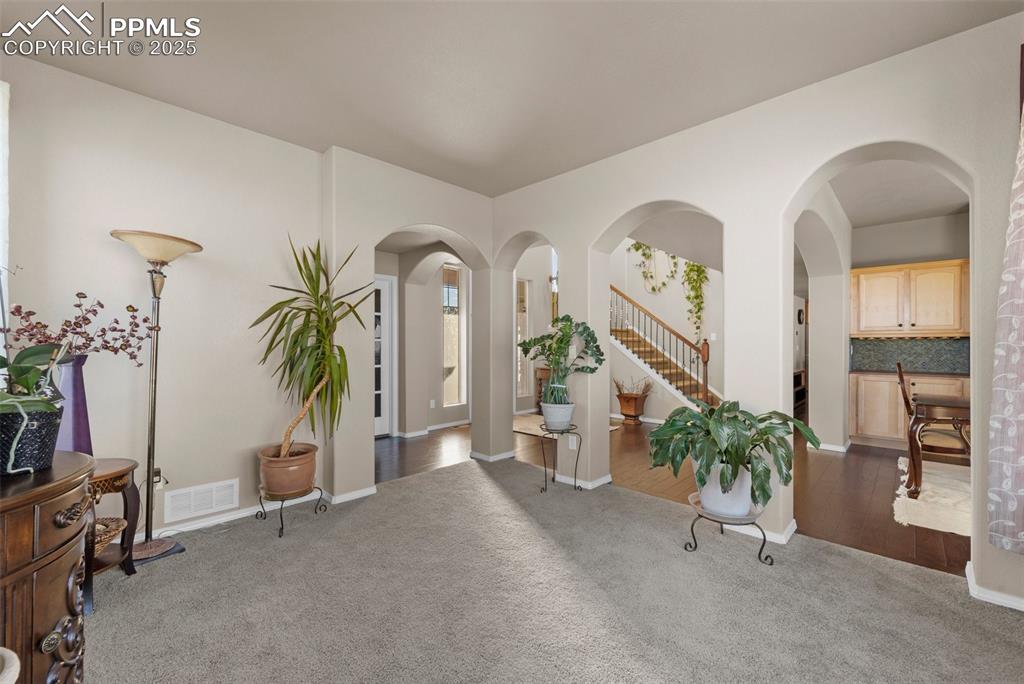 Image 15 of 50: View of carpeted entryway