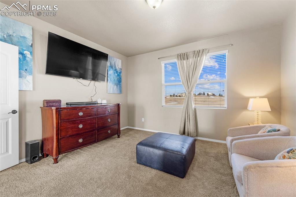 Image 41 of 50: Sitting room featuring light colored carpet