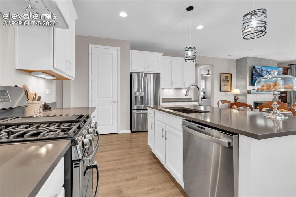 Image 12 of 36: Kitchen and Island