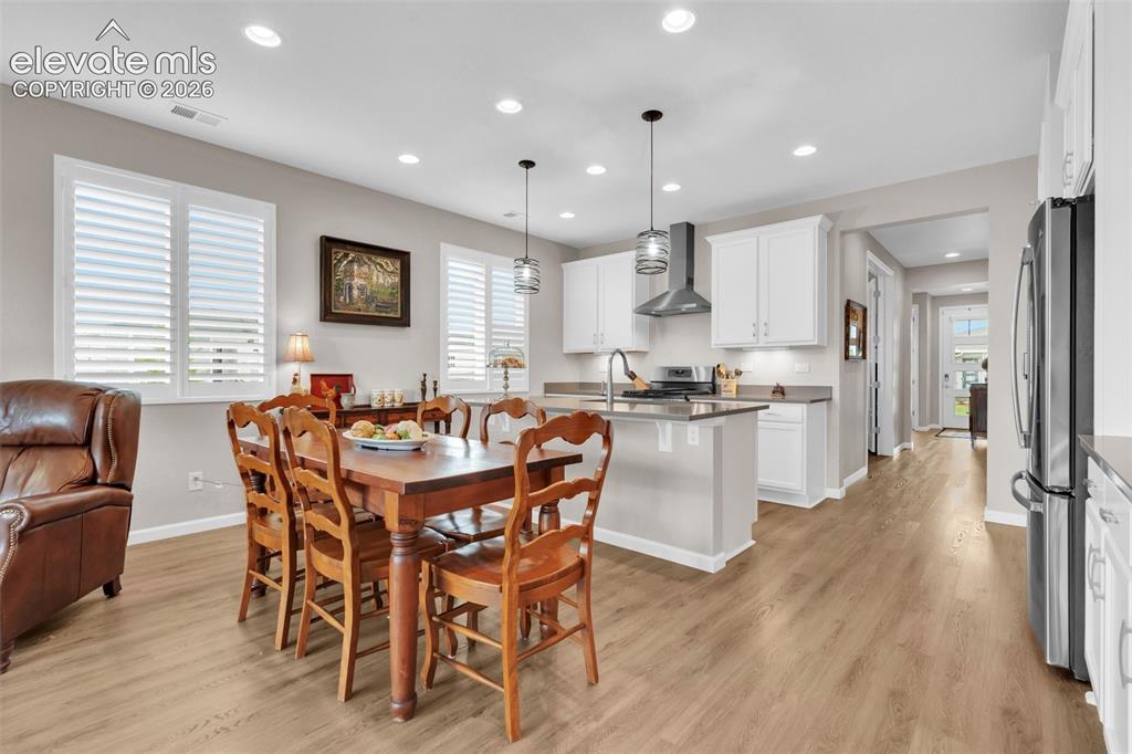 Image 16 of 36: Dining Area looking into Kitchen