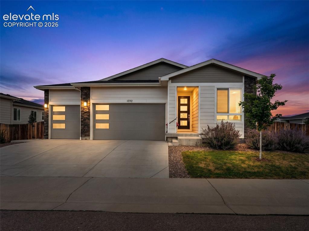 Image 2 of 36: Virtual Staged Evening Front Elevation