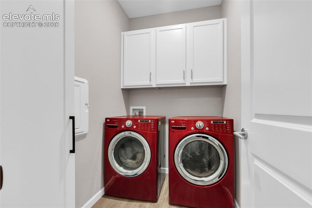 Image 25 of 36: Laundry with included Washer and Dryer