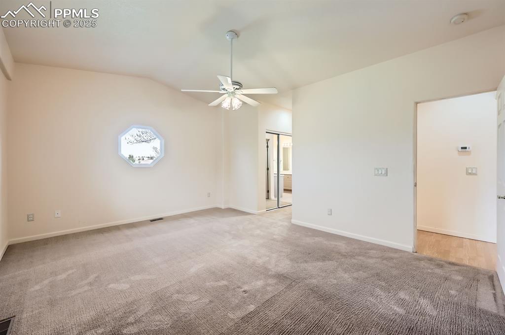 Image 11 of 27: Empty room featuring light colored carpet, a ceiling fan, visible vents, va