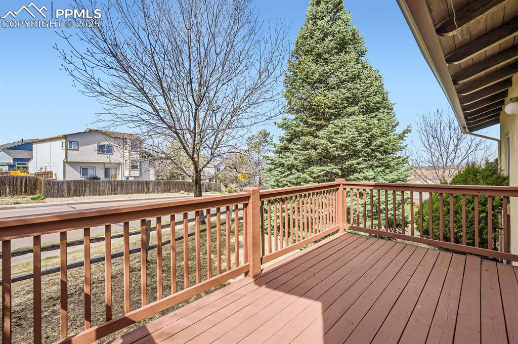 Image 24 of 27: Wooden deck featuring a residential view and fence