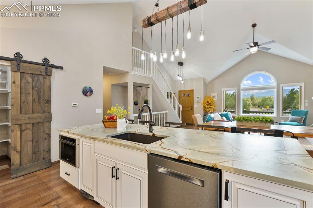 Image 12 of 44: Drawer microwave, farmhouse sink, trash compactor, silent dishwasher