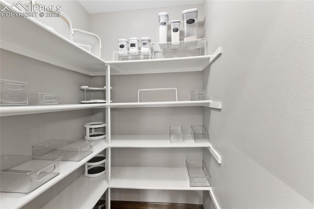 Image 16 of 44: Large walk in pantry