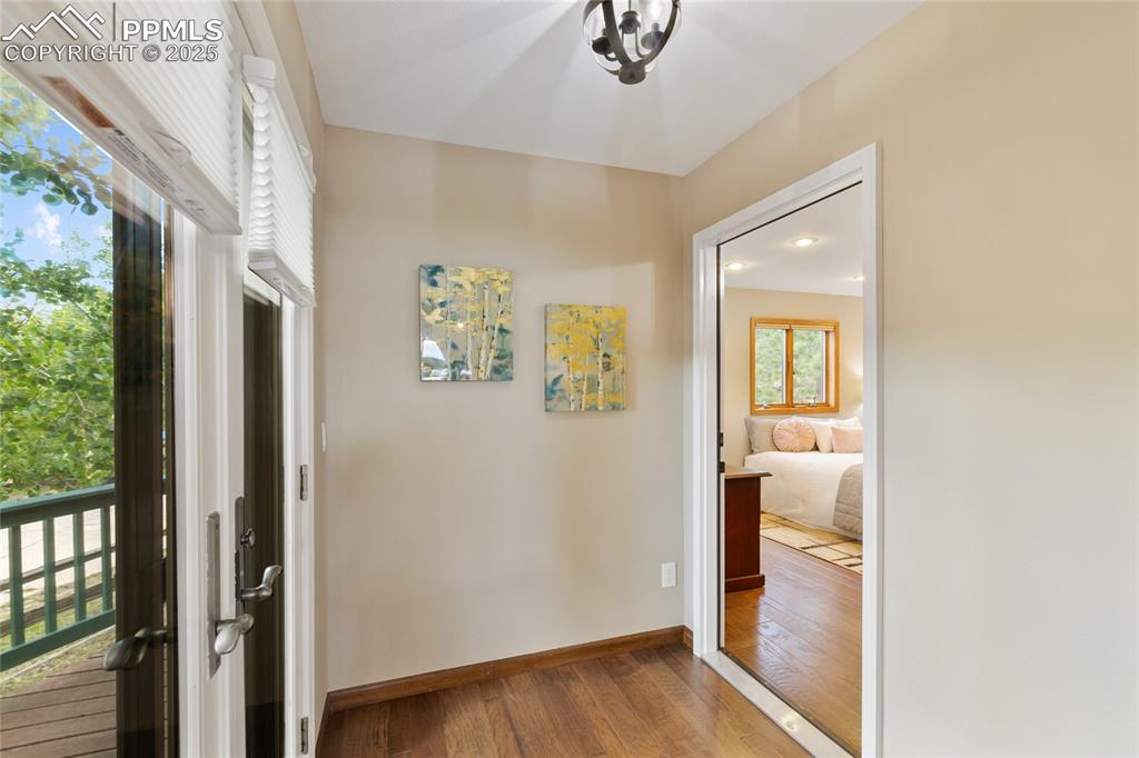 Image 19 of 44: Entry from back deck into main level suite with exterior locking door renta