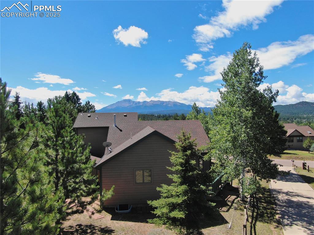 Image 2 of 44: Aerial showing back of home with Pikes Peak view