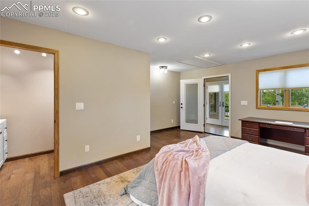 Image 21 of 44: bedroom has access panel to reinforced storage area above