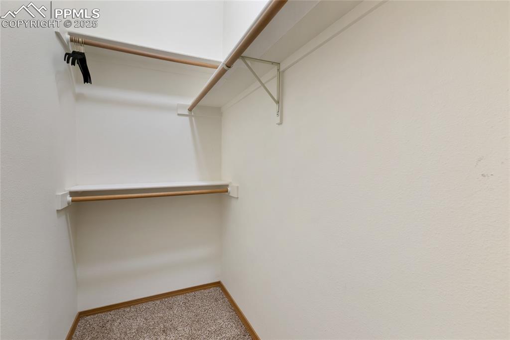Image 26 of 44: walk-in closet in upper level suite