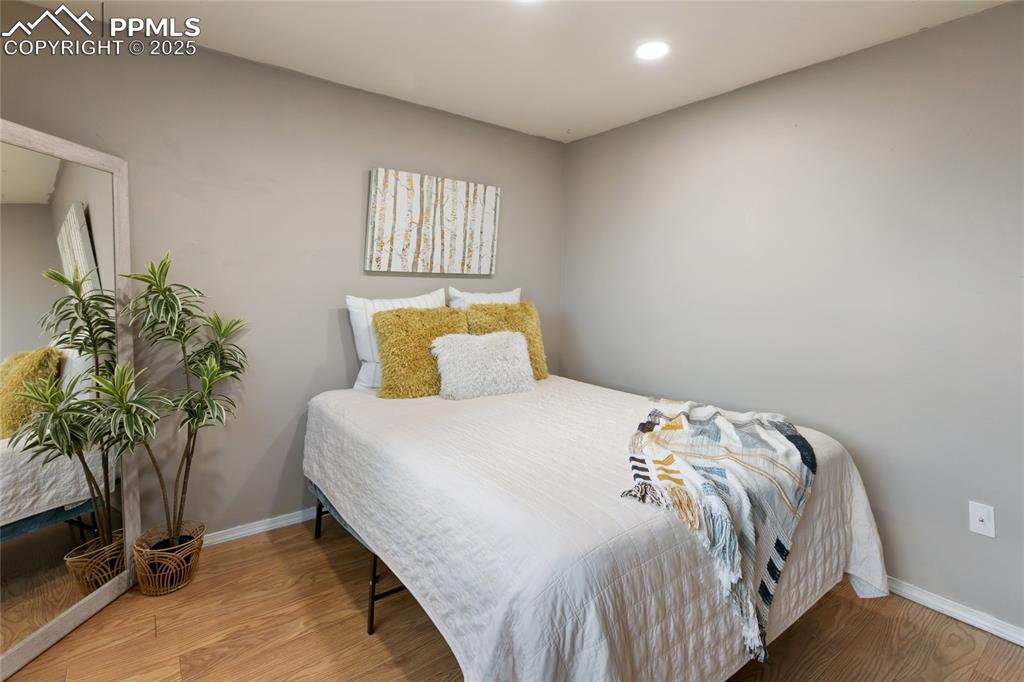 Image 30 of 44: Bedroom featuring light wood-style flooring and recessed lighting
