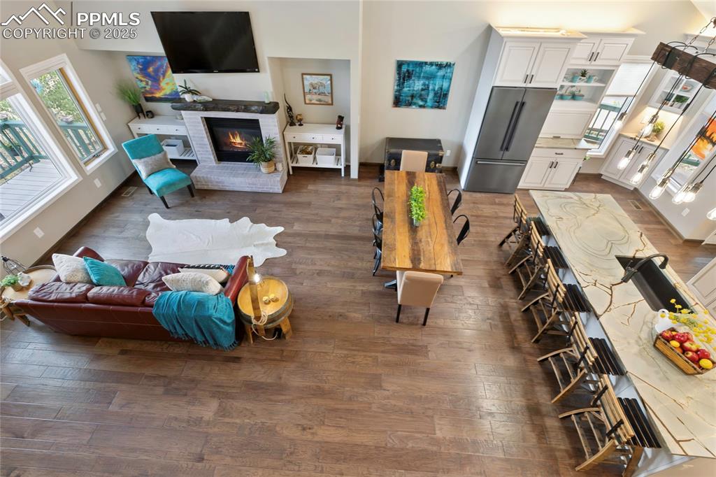 Image 5 of 44: Beautiful living area with hand scraped hickory floors