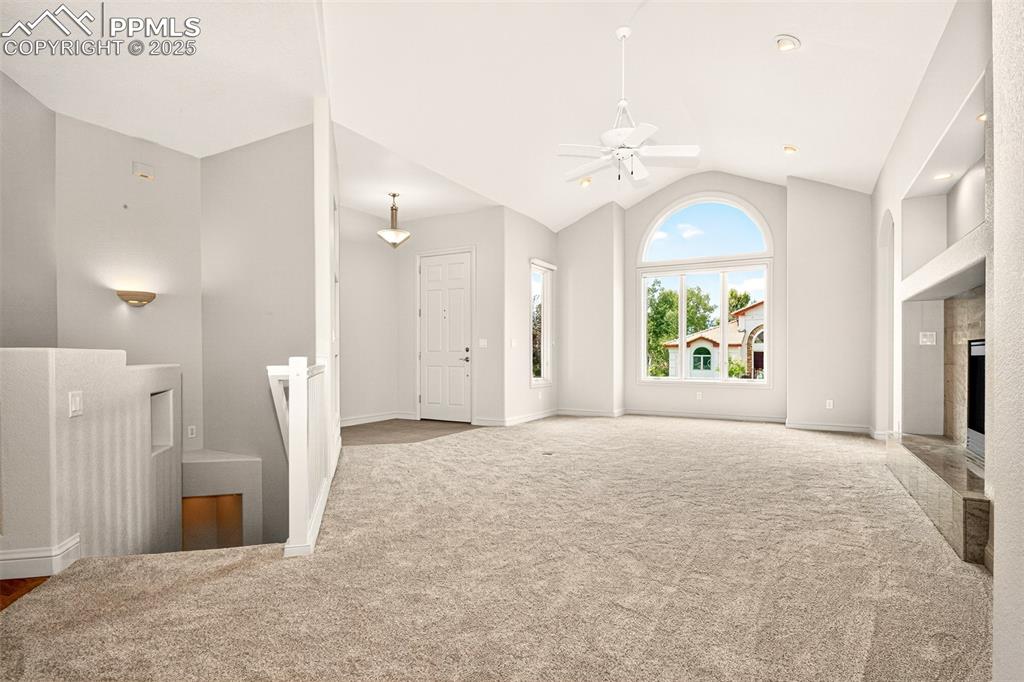 Image 6 of 35: living room with new carpet and huge picture window!