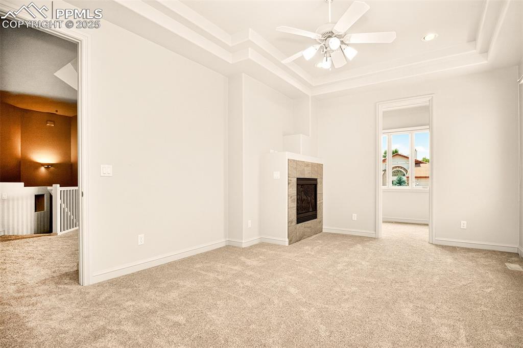Image 9 of 35: Master Bedroom on main level with a fireplace and attached 5 piece bathroom