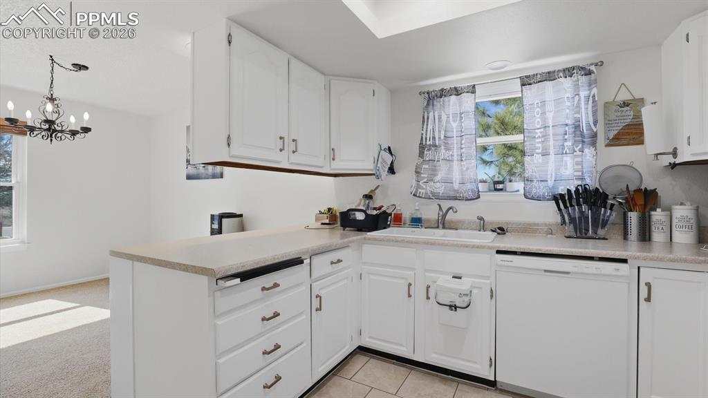 Image 20 of 50: The Dining Area has wood cabinets and convenient access to the Kitchen.