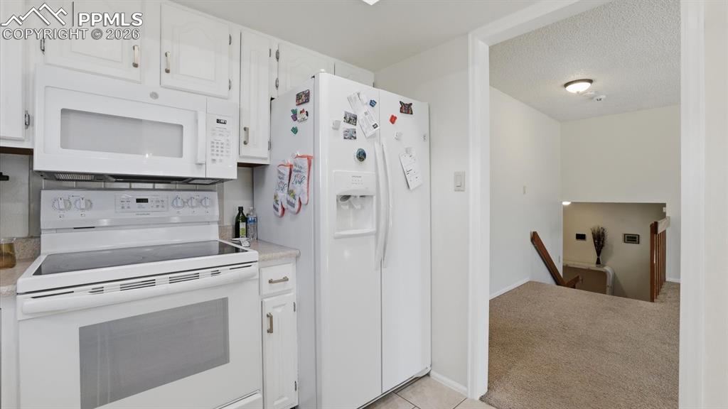 Image 22 of 50: View of the Dining Area from the Kitchen.