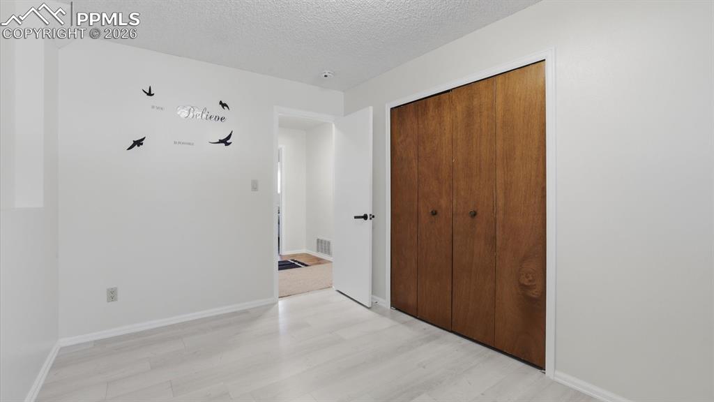 Image 38 of 50: Great entertaining area in the lower level Family Room with wet bar and woo