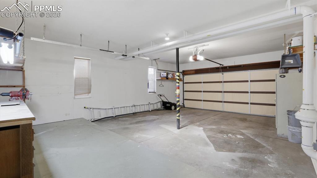 Image 42 of 50: Lower Level Bedroom #3 with wood door closet.