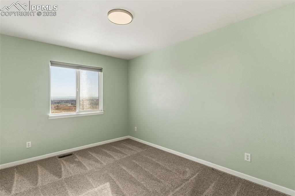 Image 28 of 50: Bedroom 2 of 4, upper level faces south