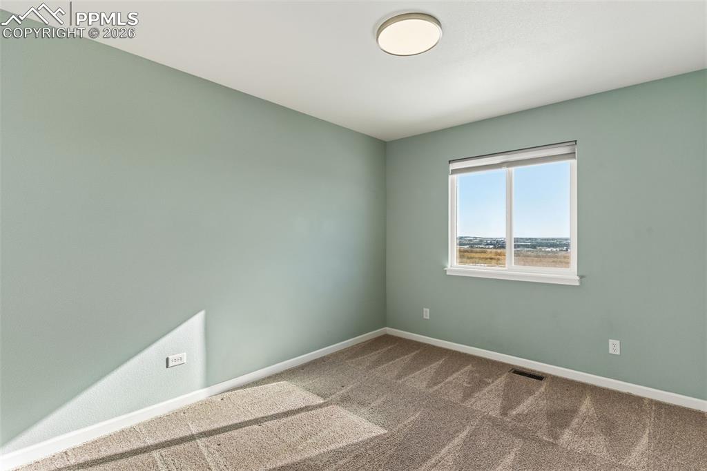 Image 31 of 50: Bedroom 3 of 4, upper level faces south