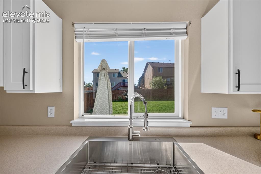 Image 10 of 31: New kitchen sink overlooking the backyard