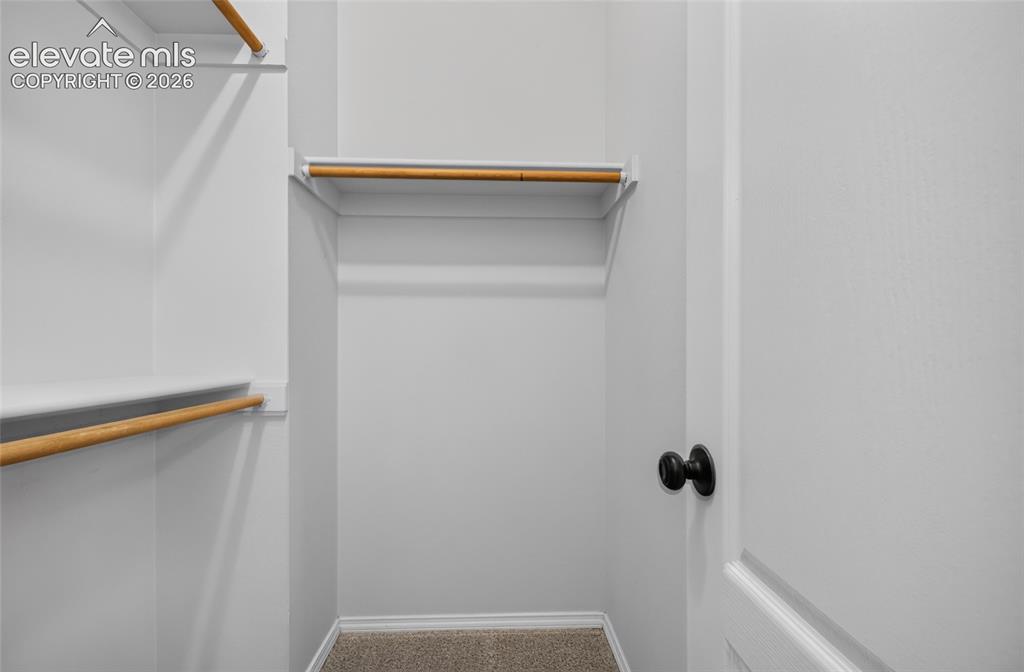 Image 14 of 31: Primary walk-in closet