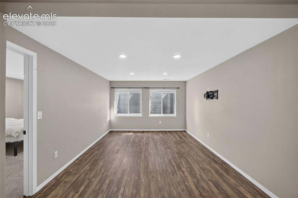 Image 18 of 31: Fully finished basement family room, permitted and finaled through Regional