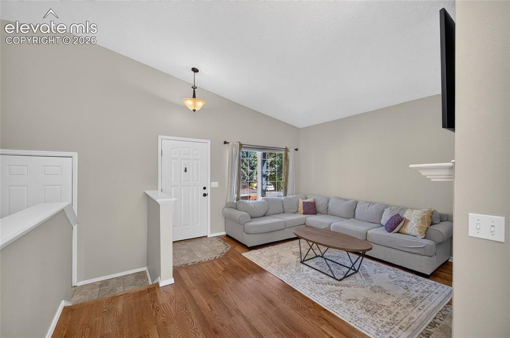 Image 6 of 31: Living room and front entry
