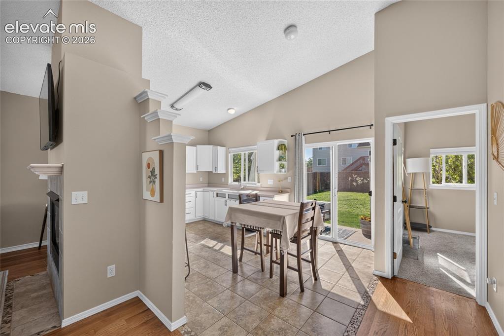 Image 7 of 31: Dining area with slider to the backyard, primary suite just off the main li