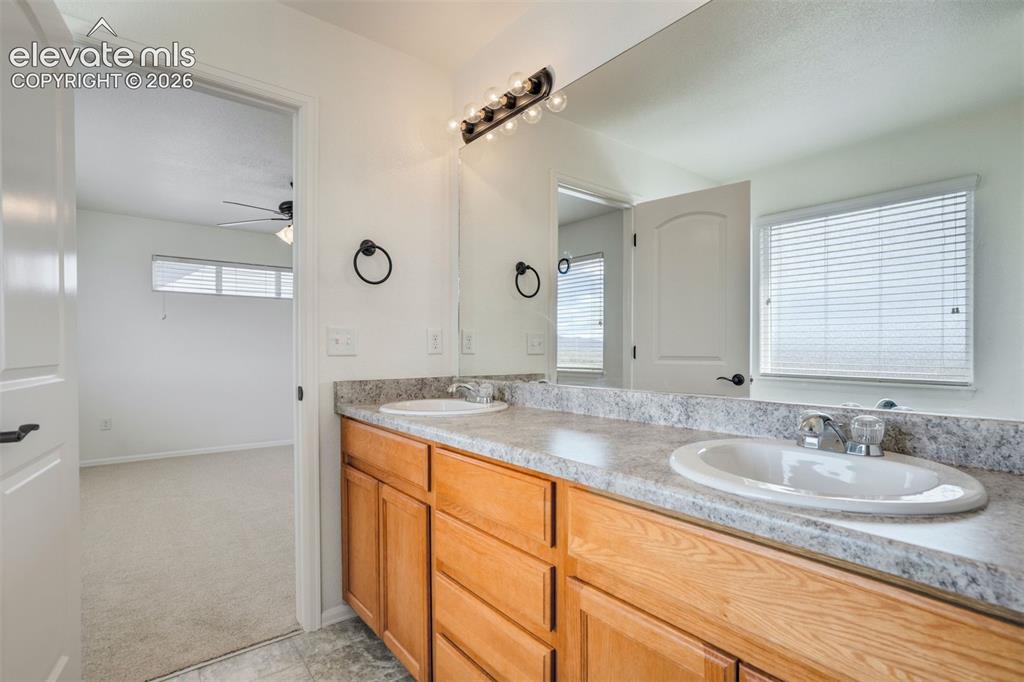Image 22 of 39: Dual sinks and plenty of counter space for your 20-step skincare routine.