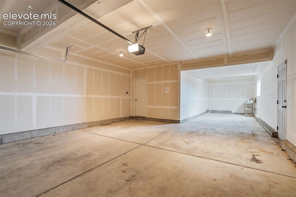 Image 35 of 39: A massive 3-car tandem garage, there’s room for the people you love, the st