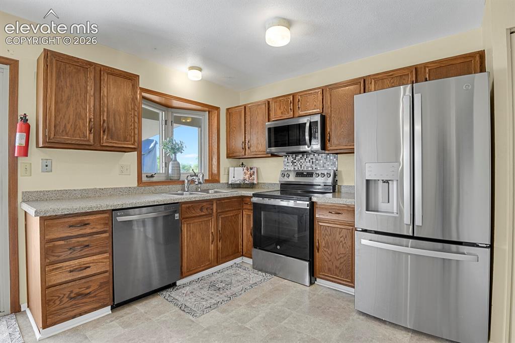 Image 8 of 28: Stainless steel appliances.