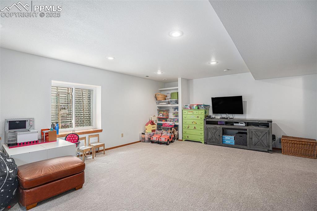 Image 15 of 27: Carpeted living room featuring recessed lighting and baseboards