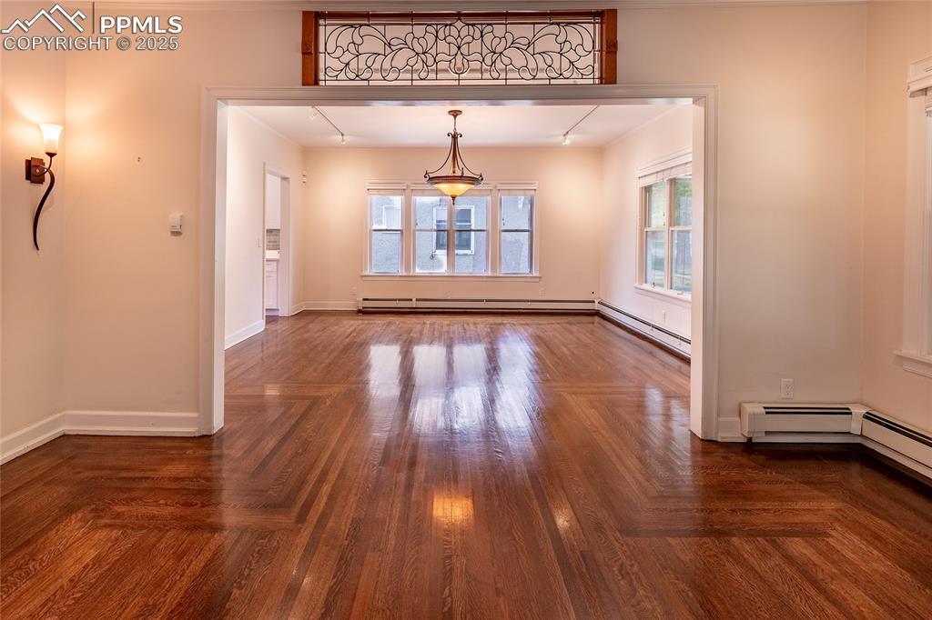 Image 10 of 49: Dining area from living room. Beveled glass was from a Chicago mansion in t