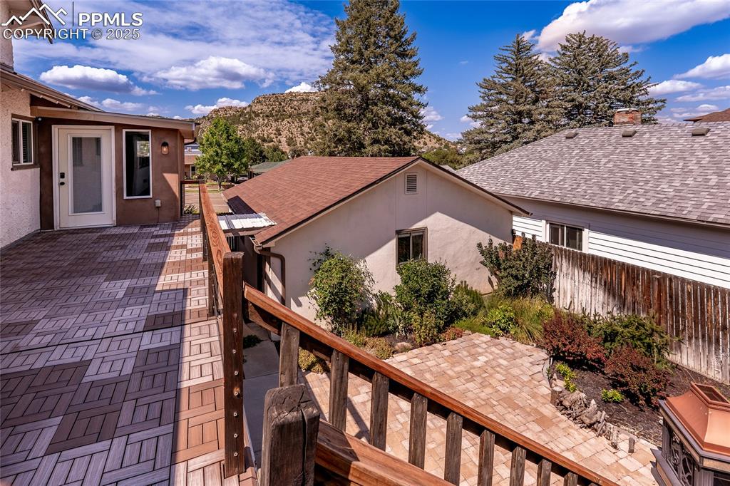 Image 33 of 49: Wooden terrace with a patio