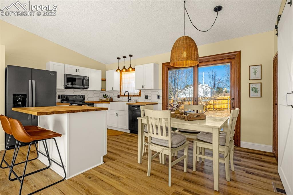 Image 2 of 20: Kitchen with Island and dining View