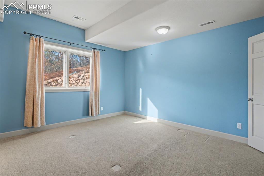 Image 24 of 44: Basement bedroom number 2.