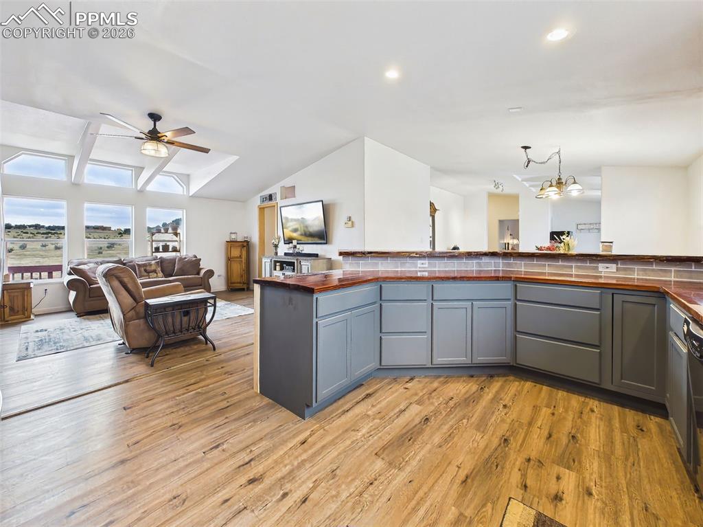 Image 10 of 50: Kitchen – Peninsula & Storage – Expansive peninsula with corrugated metal a