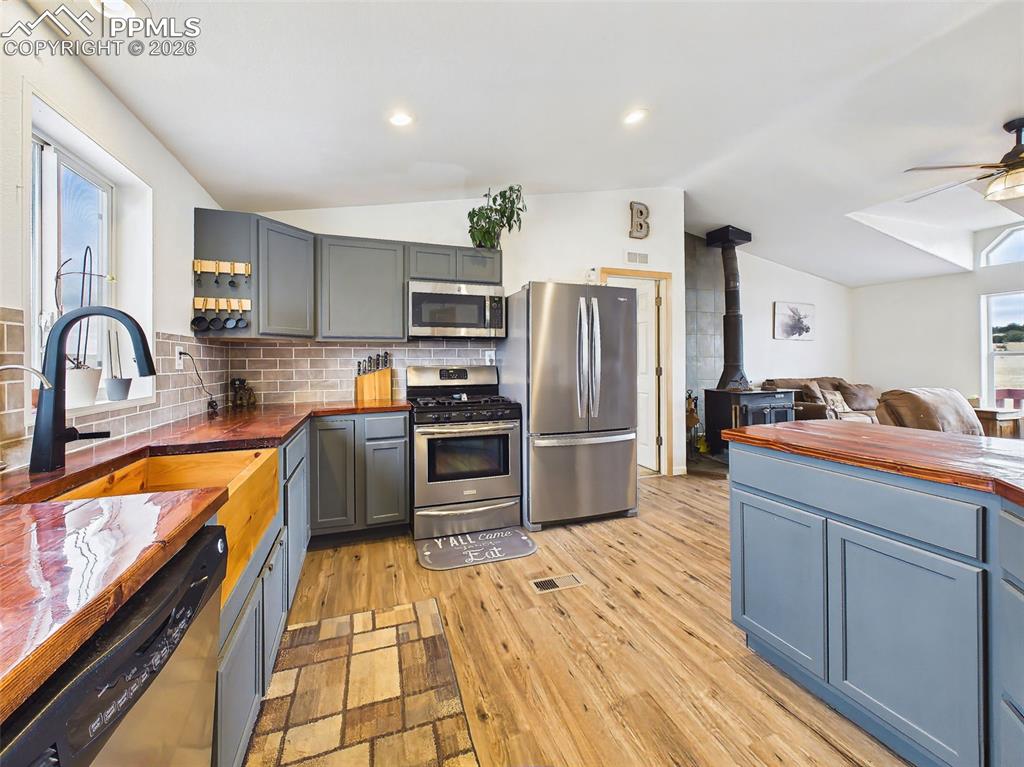 Image 13 of 50: Kitchen – Full View to Living Area – Open-concept kitchen flows seamlessly 