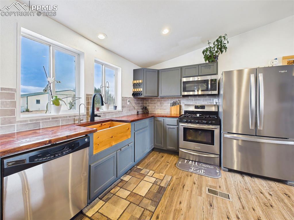 Image 14 of 50: Kitchen – Workspace View – Stainless steel appliances complement the upgrad