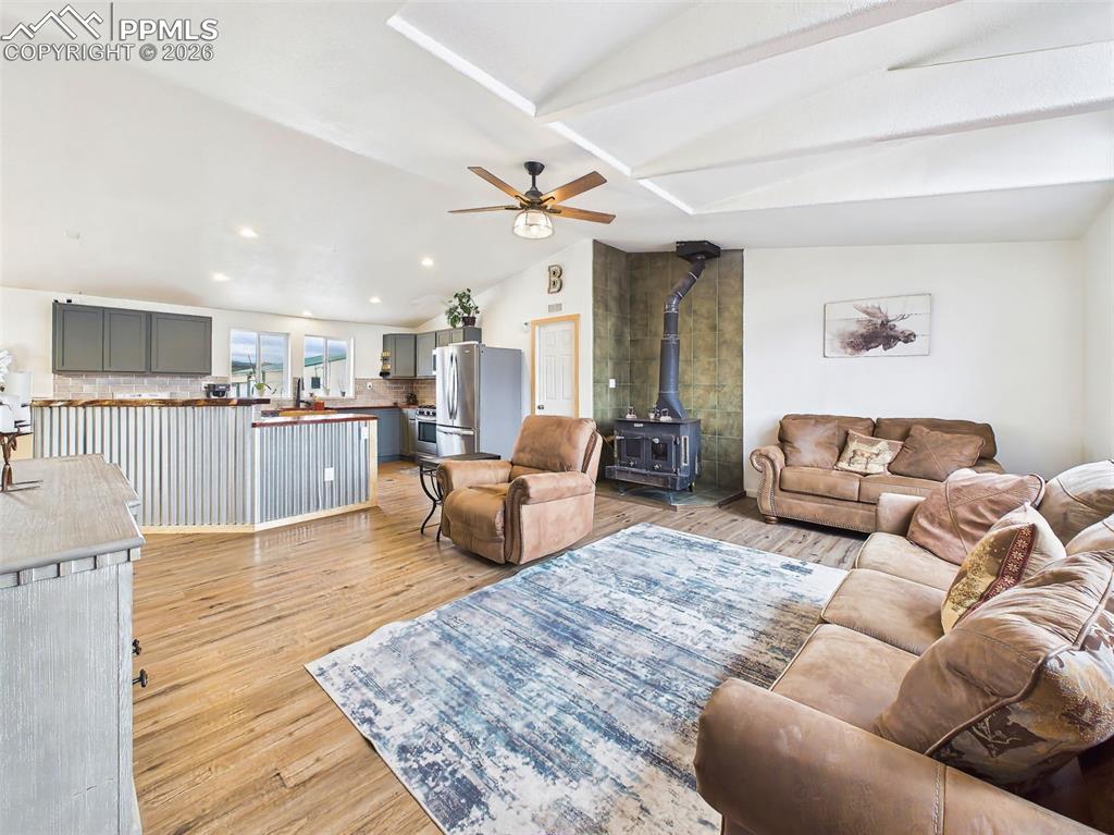 Image 17 of 50: Family Room – Open Concept View – Vaulted ceilings with architectural beams