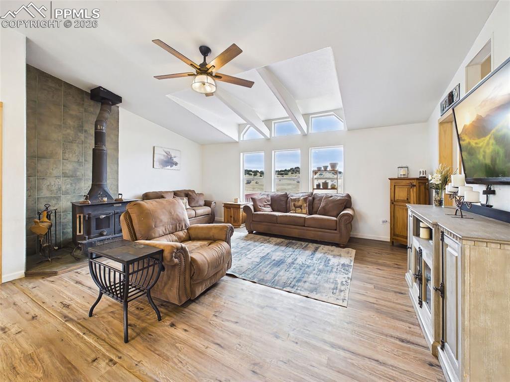 Image 18 of 50: Family Room – Window Wall & Views – Large windows frame expansive views of 