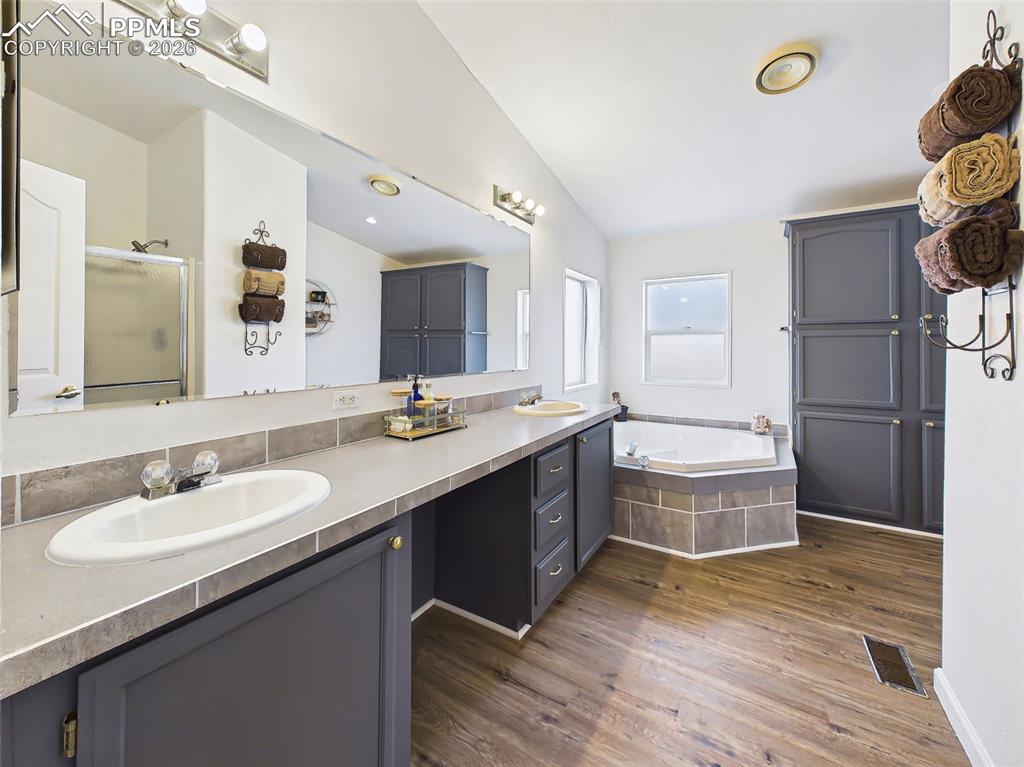 Image 23 of 50: Primary Bathroom – Double Vanity – Updated primary bath with dual sinks, ex