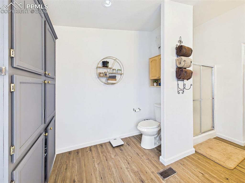 Image 24 of 50: Primary Bathroom – Shower & Water Closet – Separate shower area and private