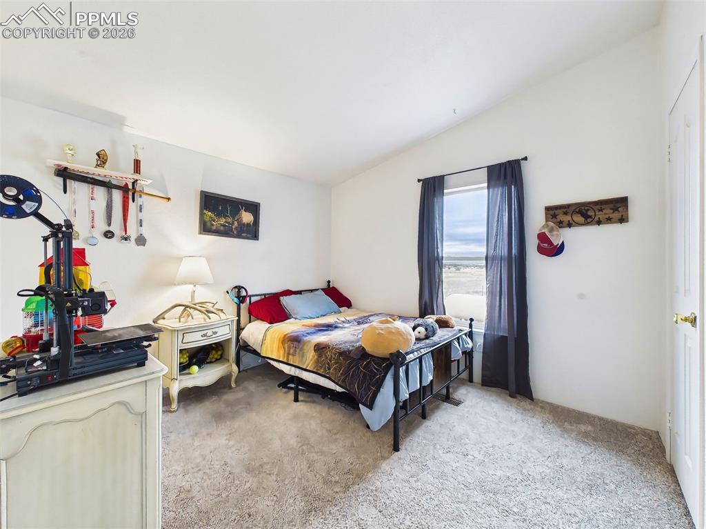 Image 28 of 50: Bedroom – Bright additional bedroom featuring generous window views and neu